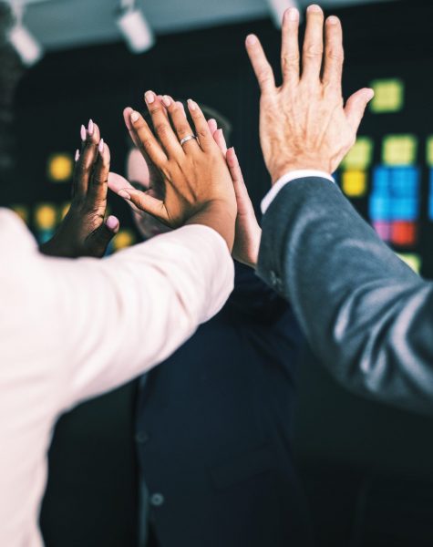 Business team giving a high five